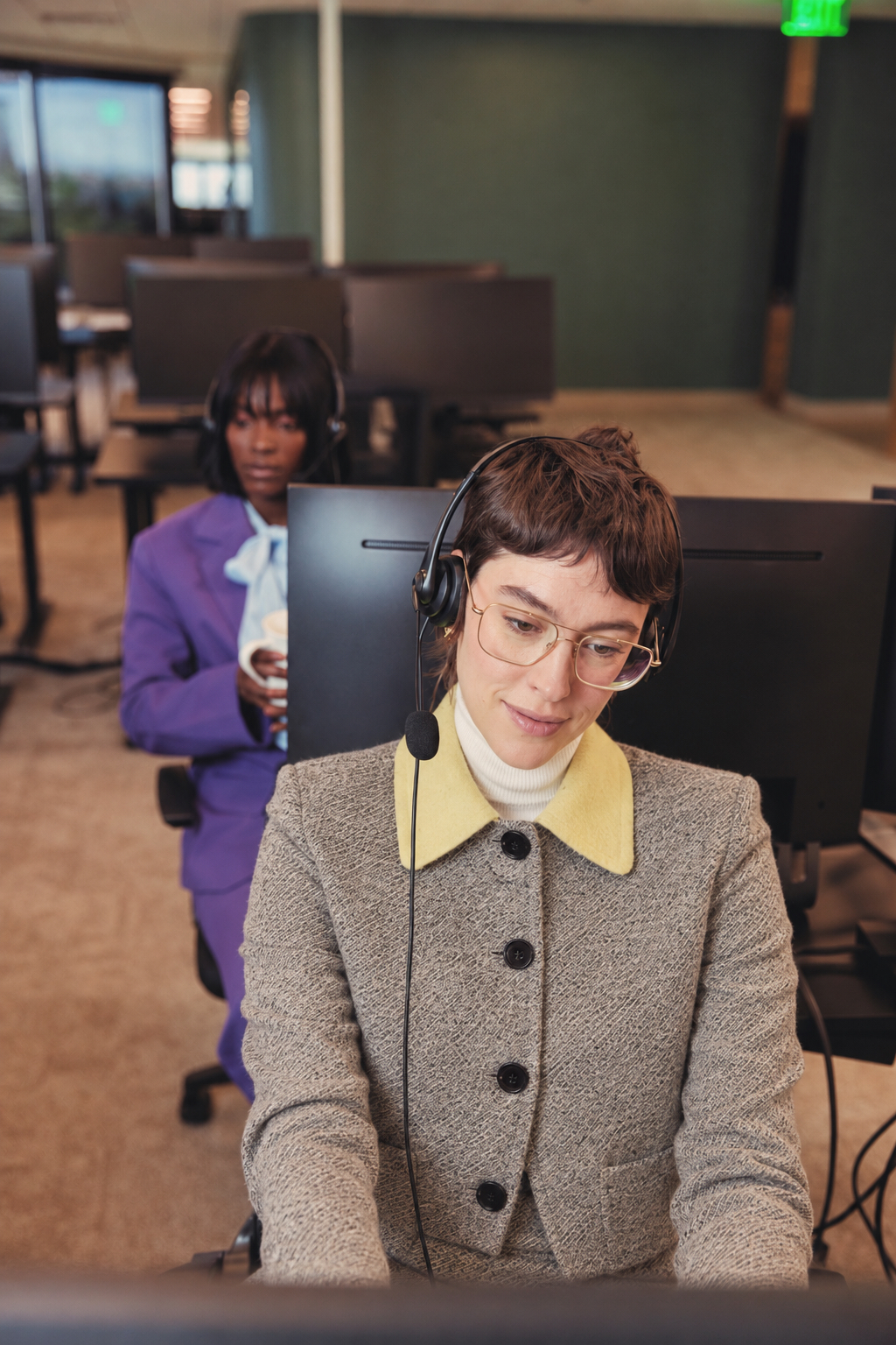 Signal House agent speaking with a customer at her workstation